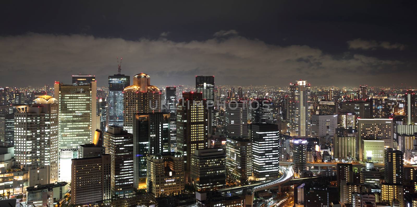 Osaka city in Japan cityscape at night view by piyato