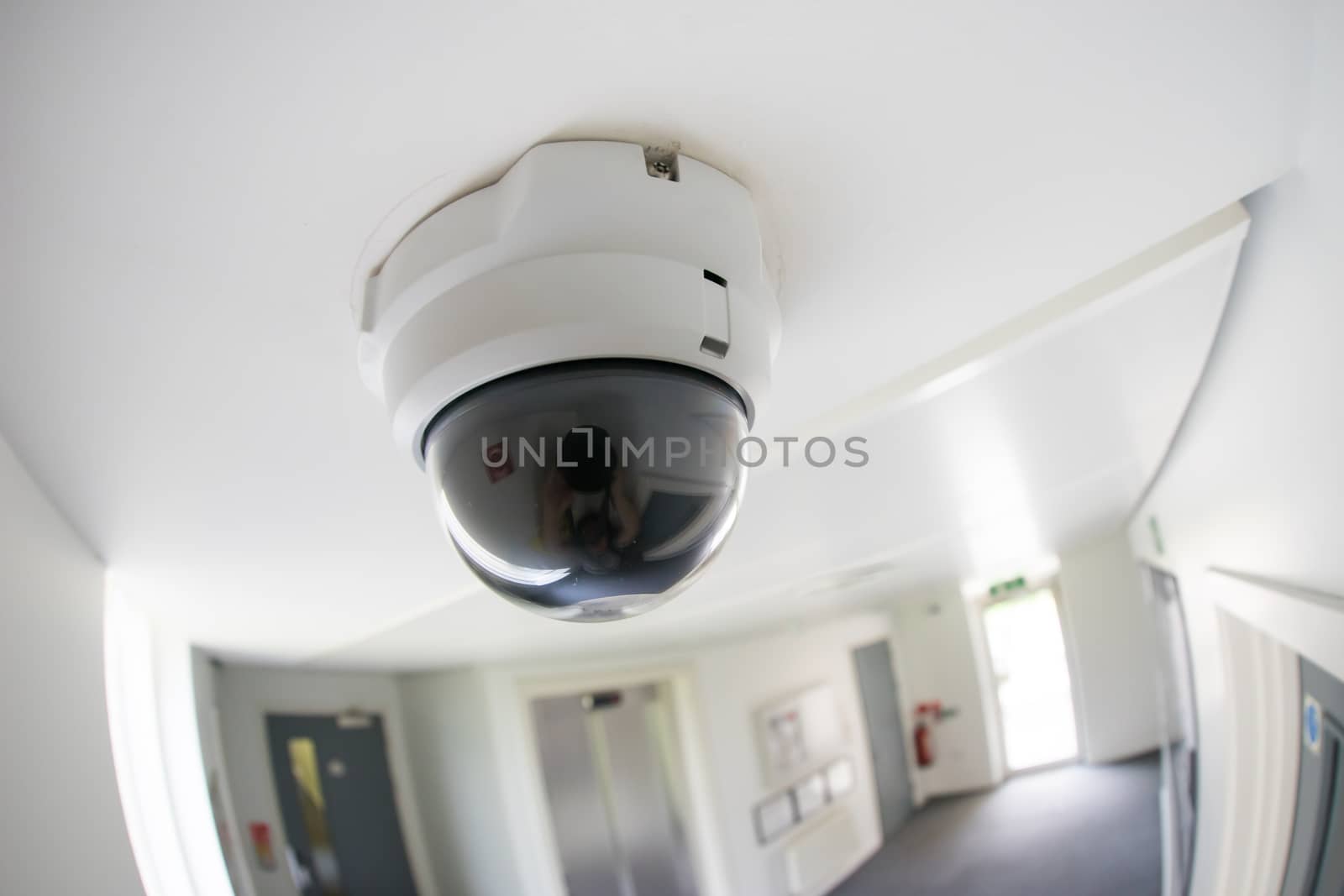 Security, CCTV camera in office building by Alicephoto