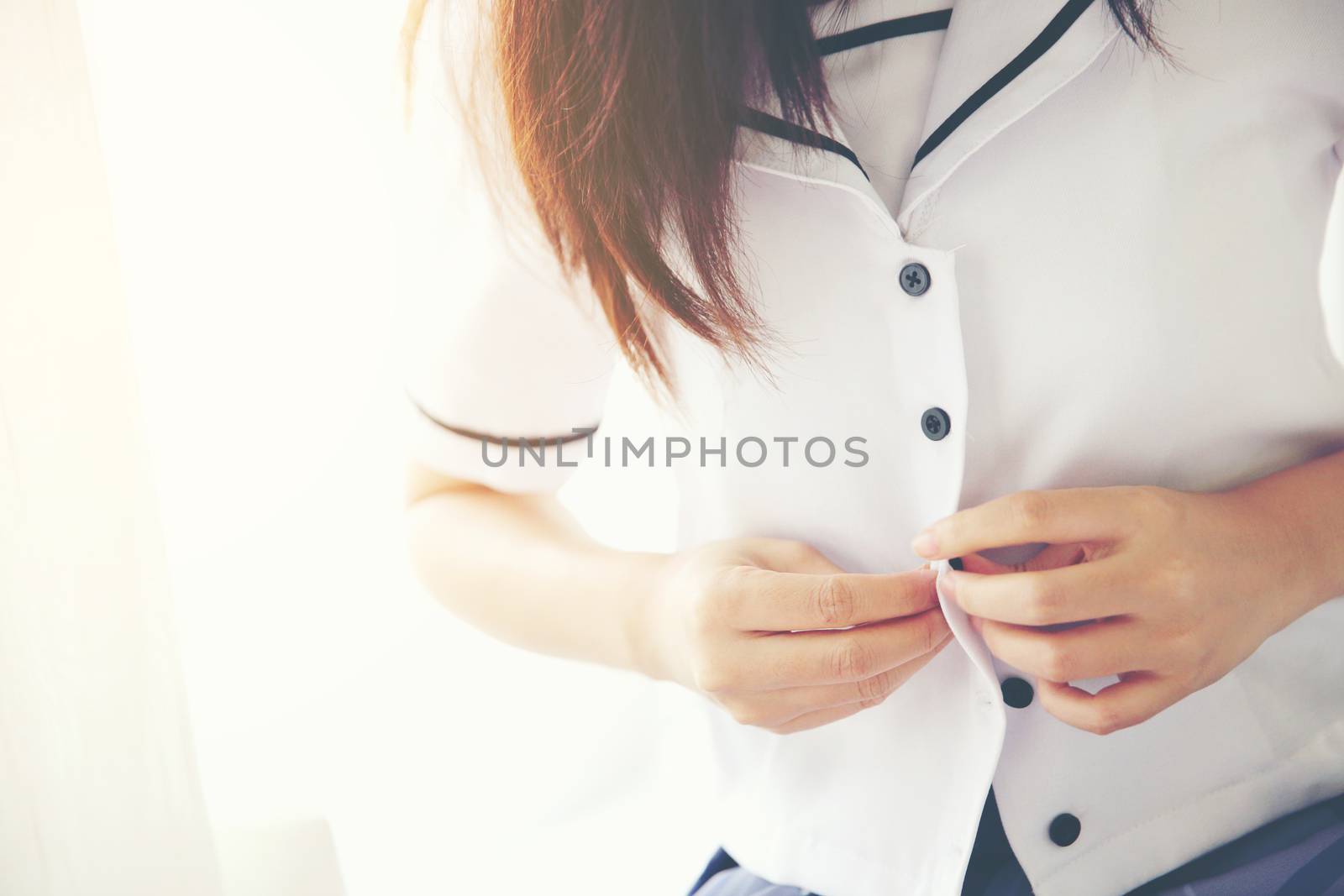 One asian school girl dressing up in white tone and flare