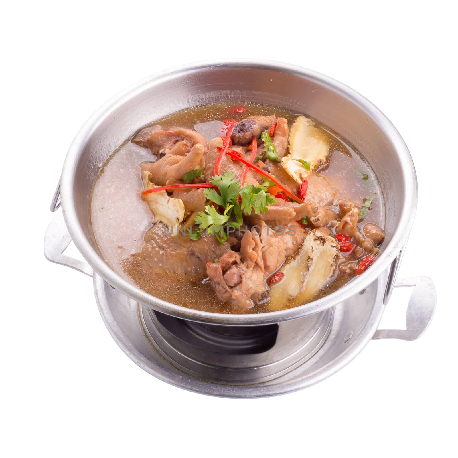 Chicken and herb soup in pot on white background.