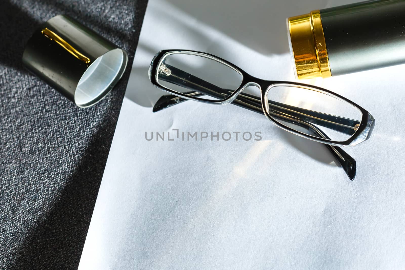 Glasses on paper with the engineer's office. by Andelov13