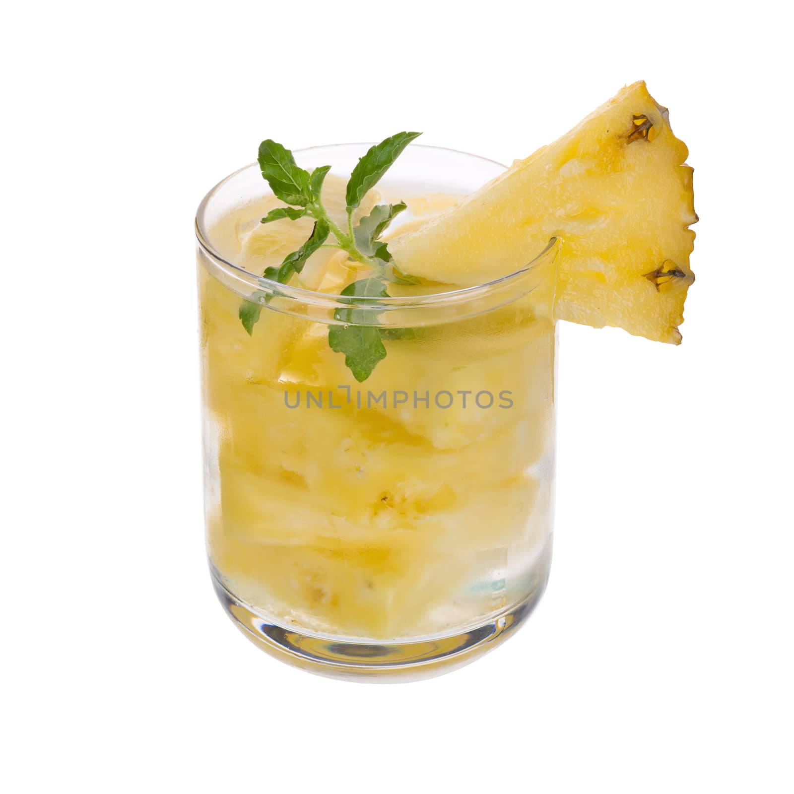 Glasses of pineapple juice with pieces of pineapple healthy drink concept.