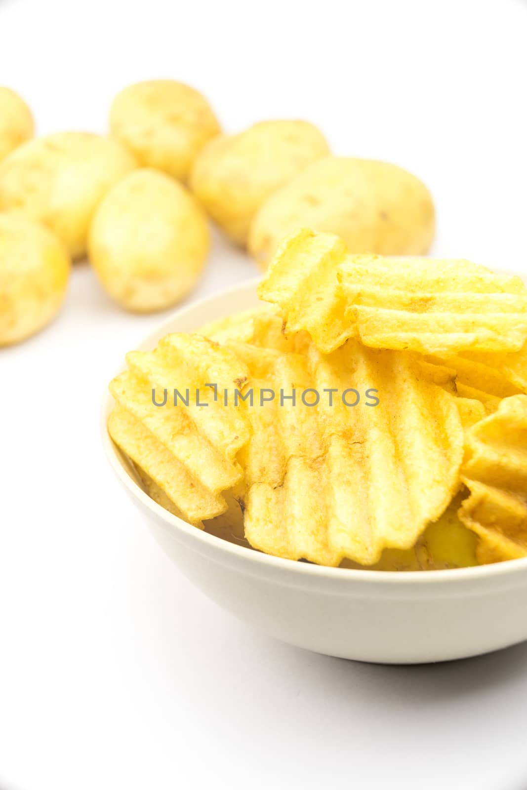 Potato chips on white background

 by Alicephoto