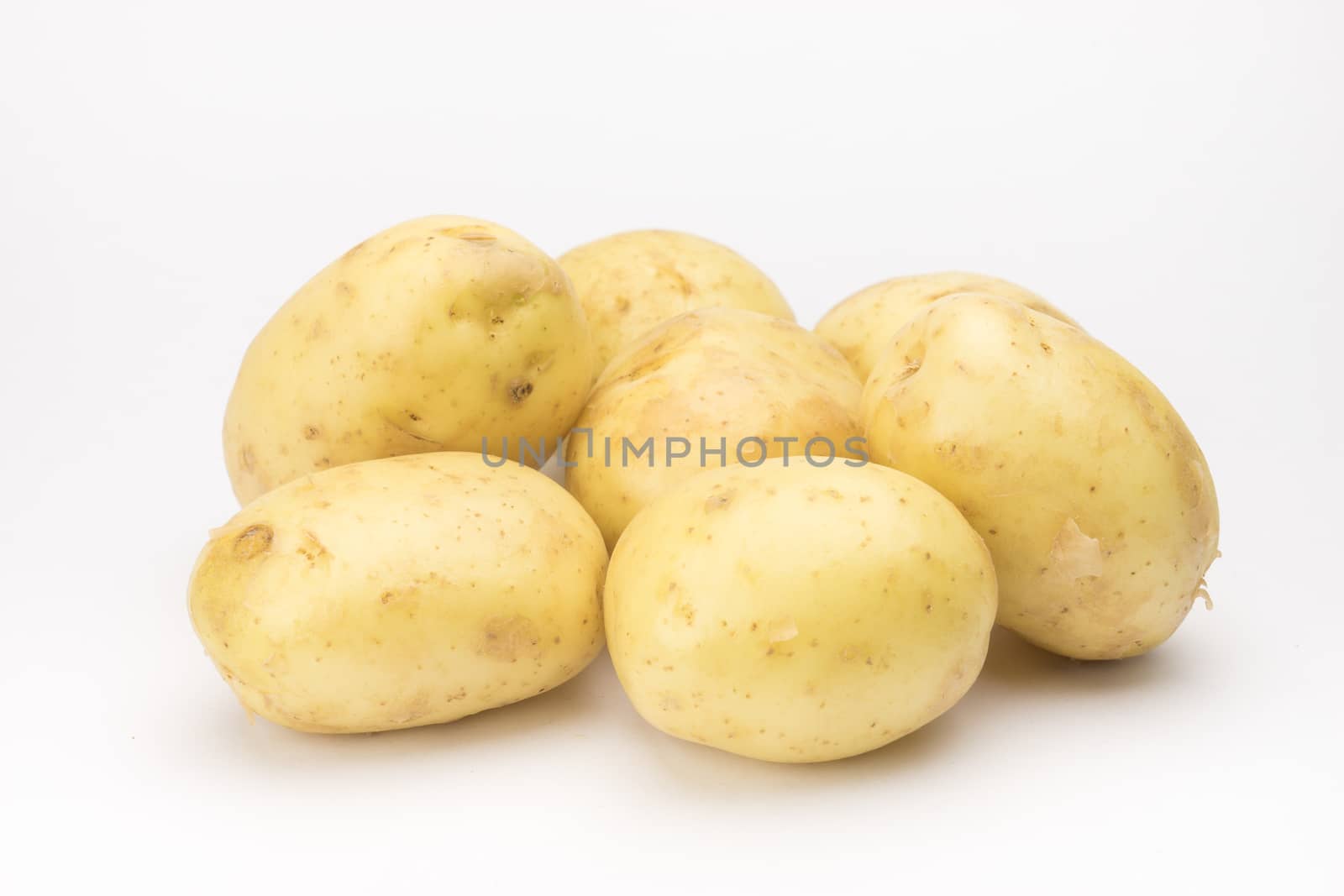 Potato on the white background by Alicephoto