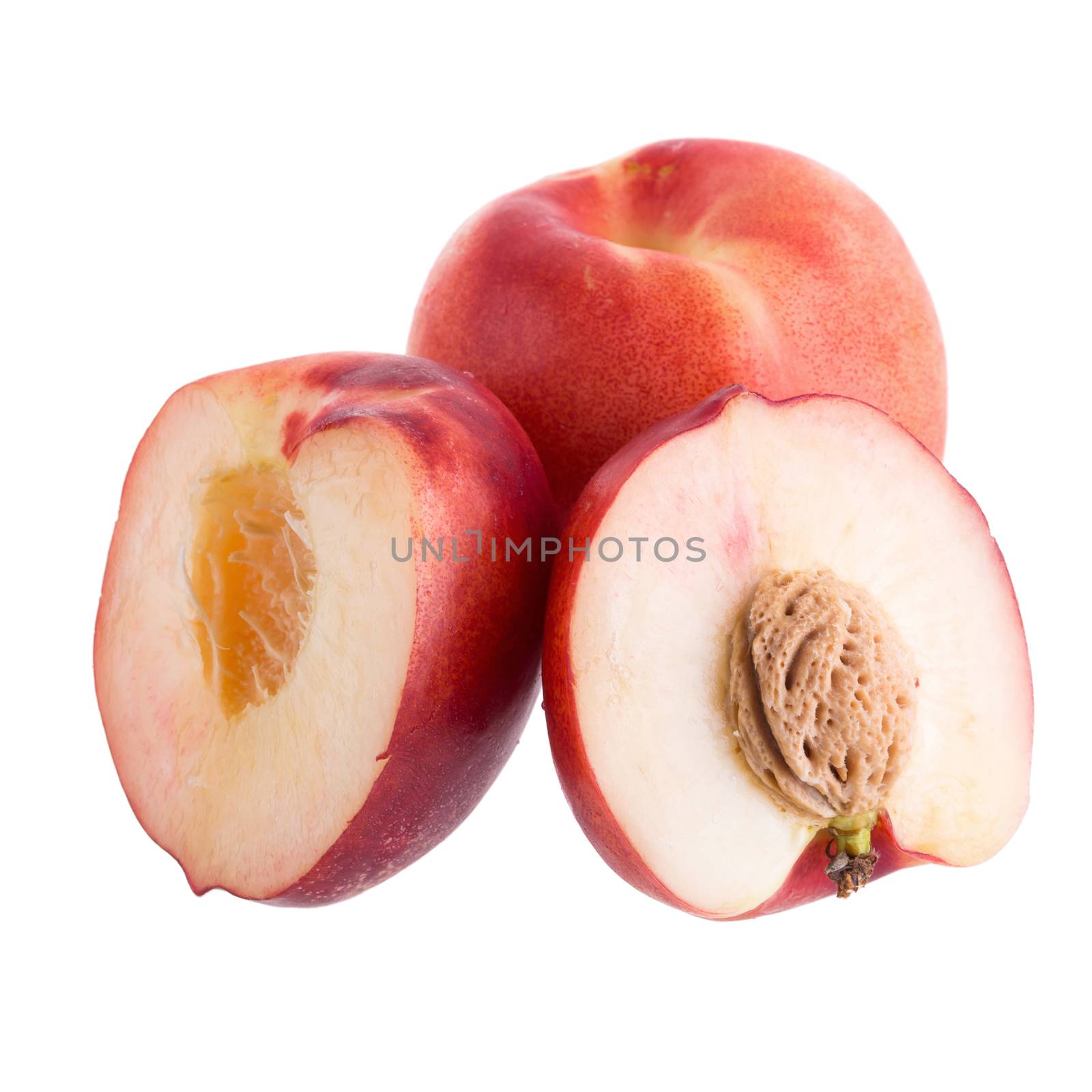 ripe fresh Nectarine fruit  with half and slice isolated on white background.