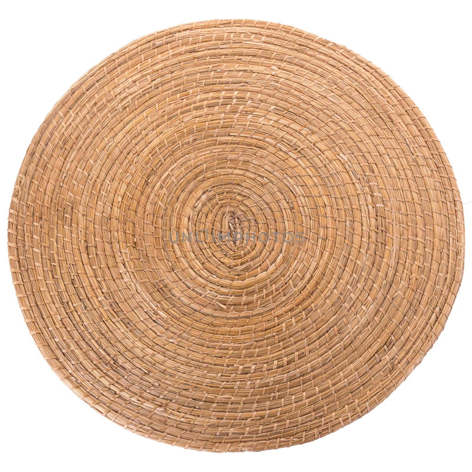 golden  round wicker mat on white background by kaiskynet