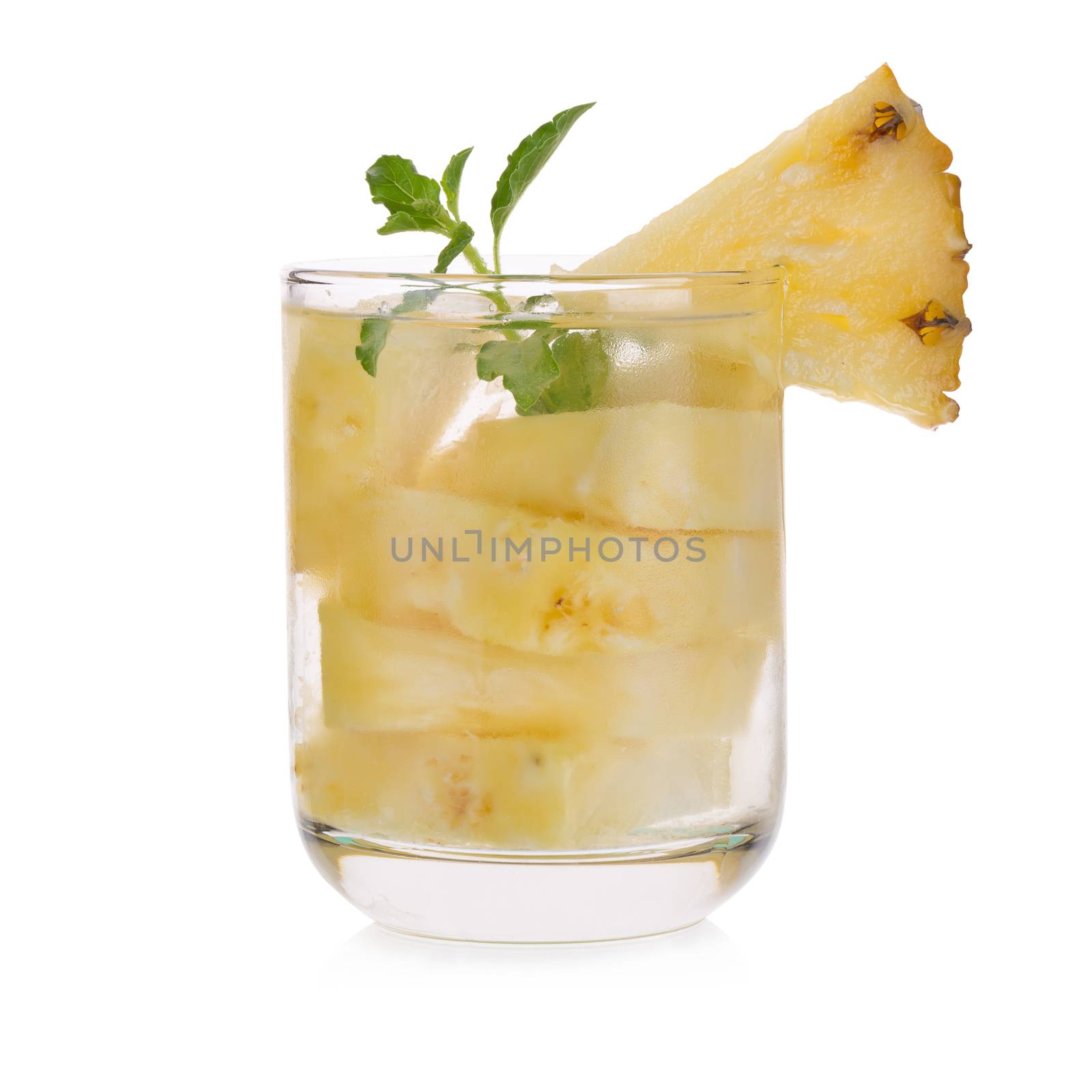 Glasses of pineapple juice with pieces of pineapple healthy drink concept.