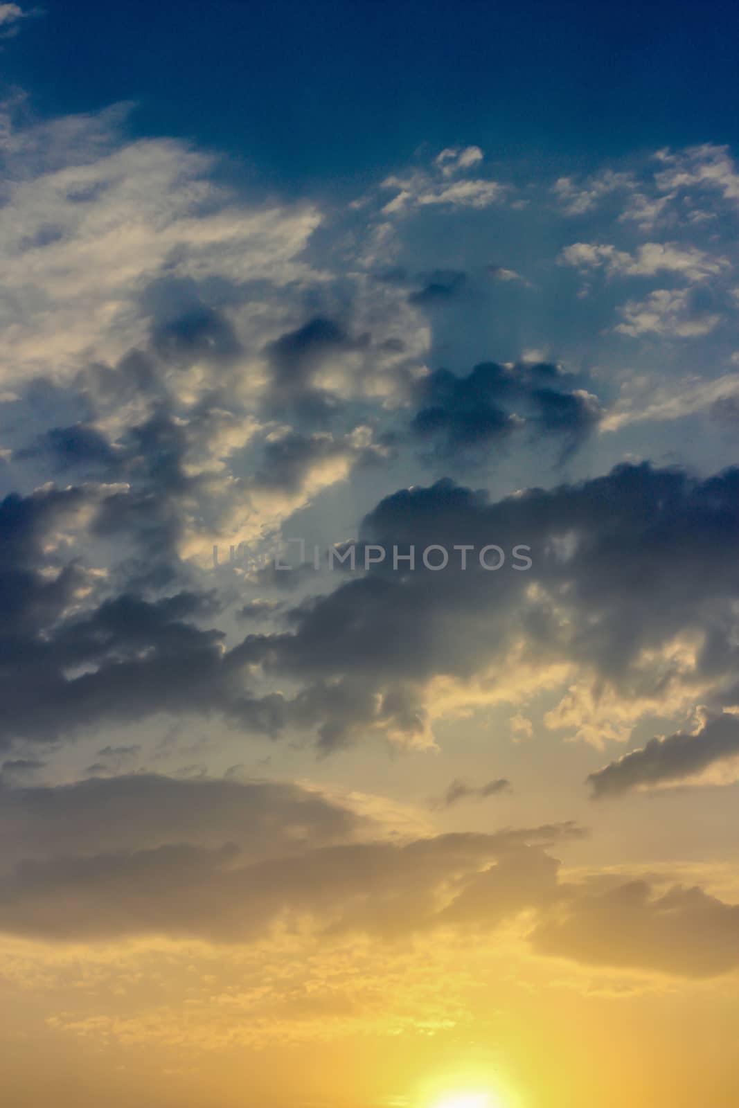 Colorful dramatic sky with cloud at sunset.Sky with sun background