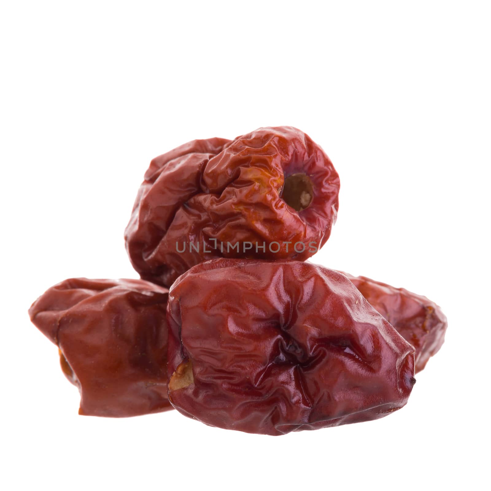 Dried jujube fruits chinese herbal medicine on a white backgroun by kaiskynet