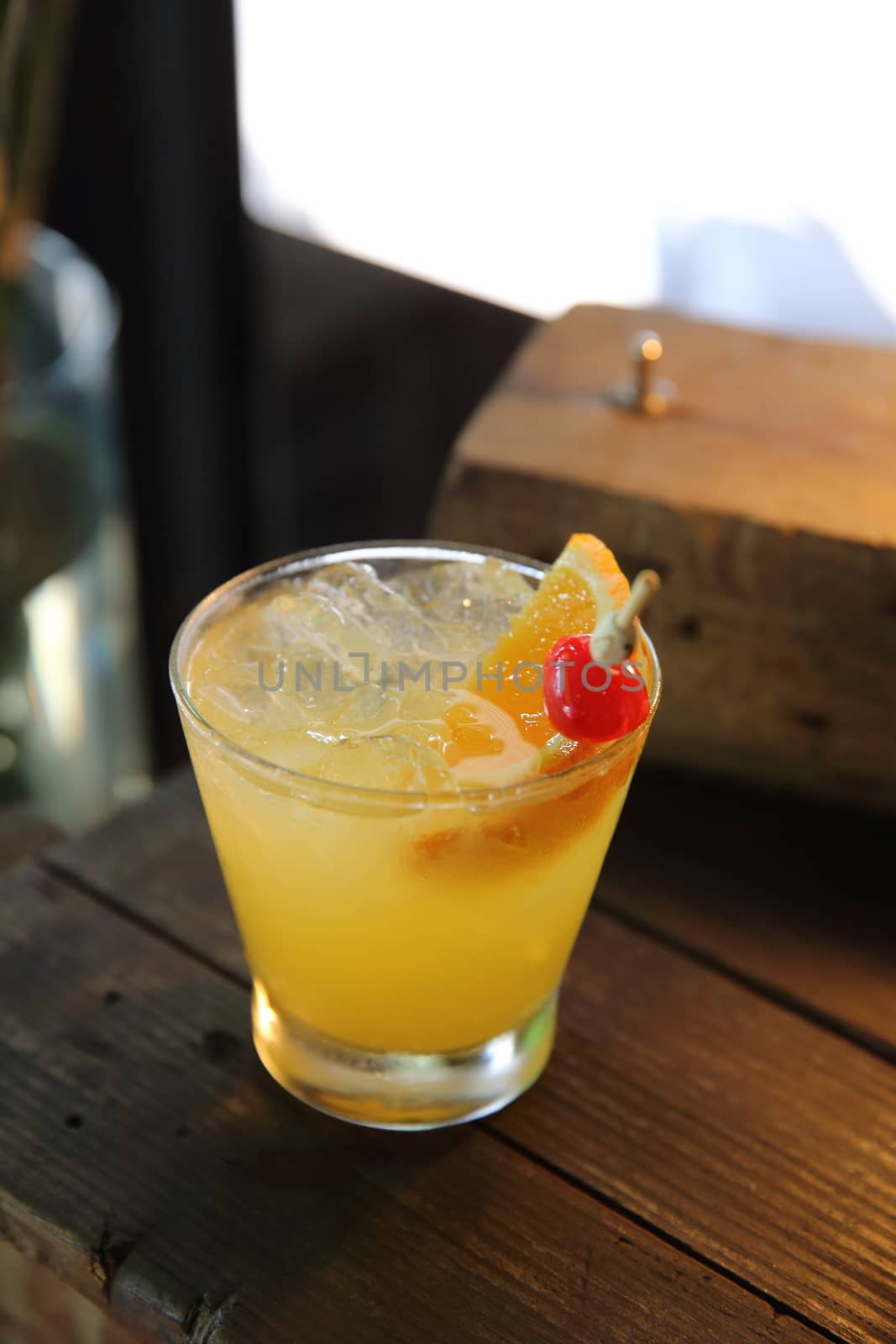 mai tai cocktail with orange cherry fruits on wood background