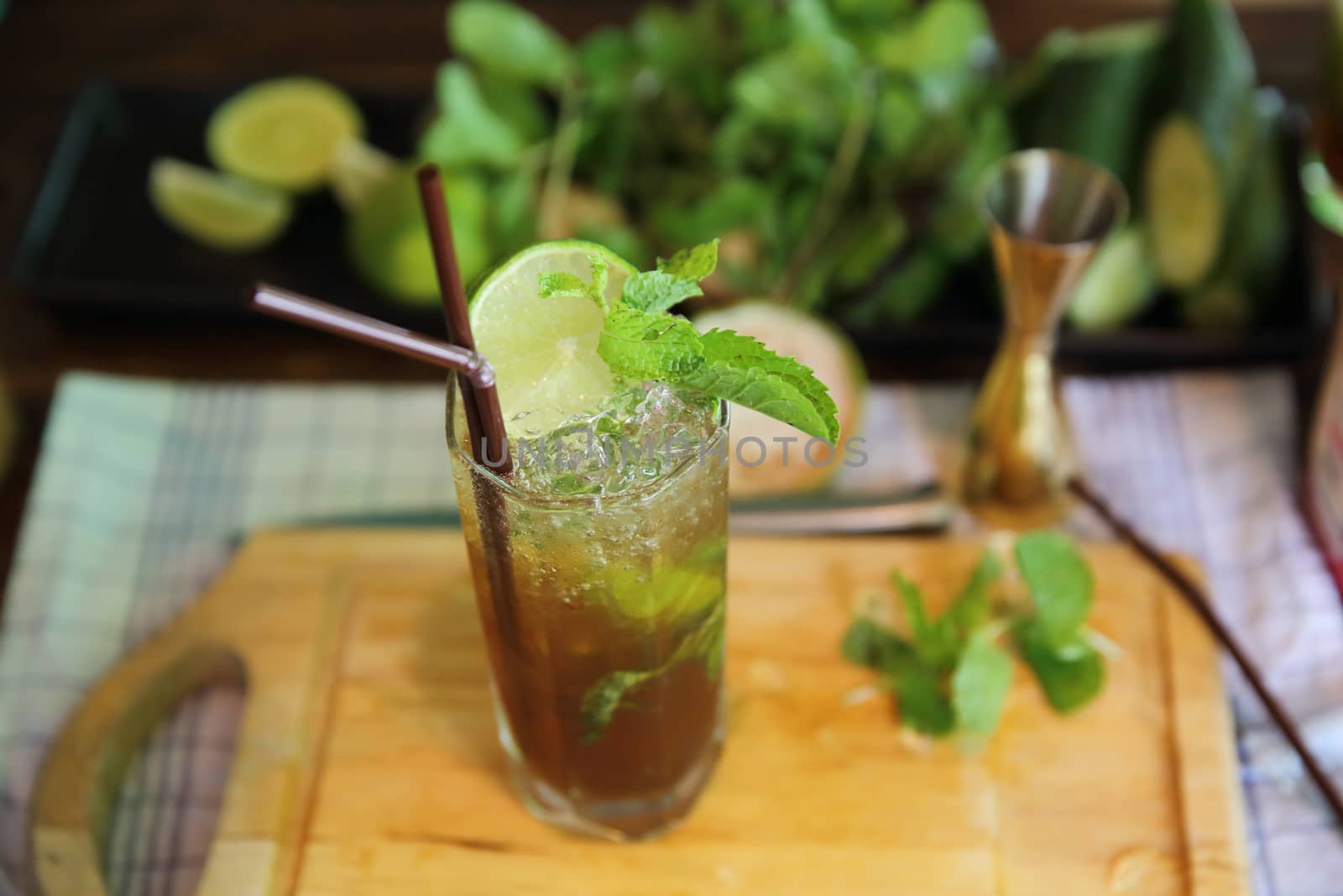 Mojito cocktail drink with mint and lemon background