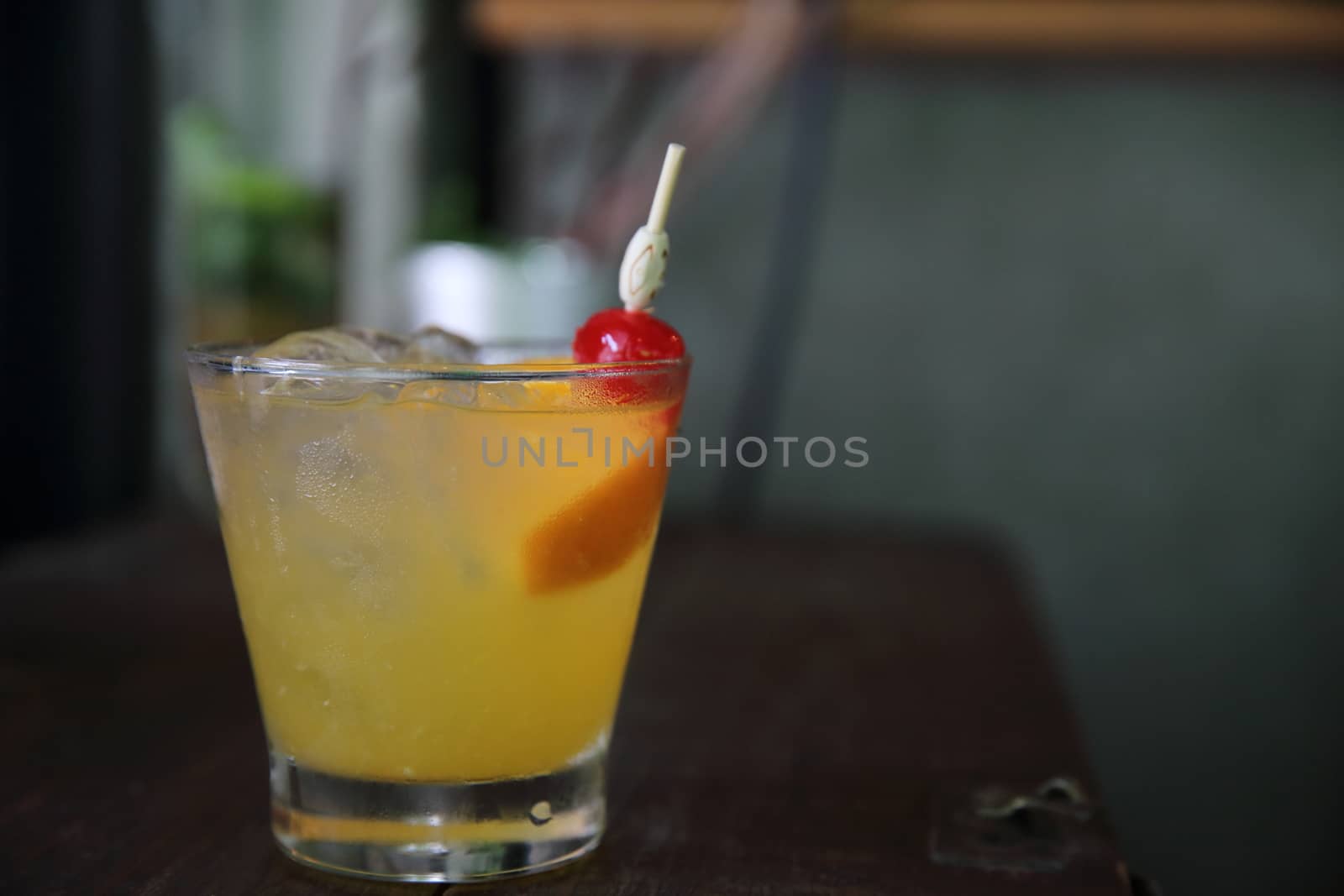 mai tai cocktail with orange cherry fruits on wood background