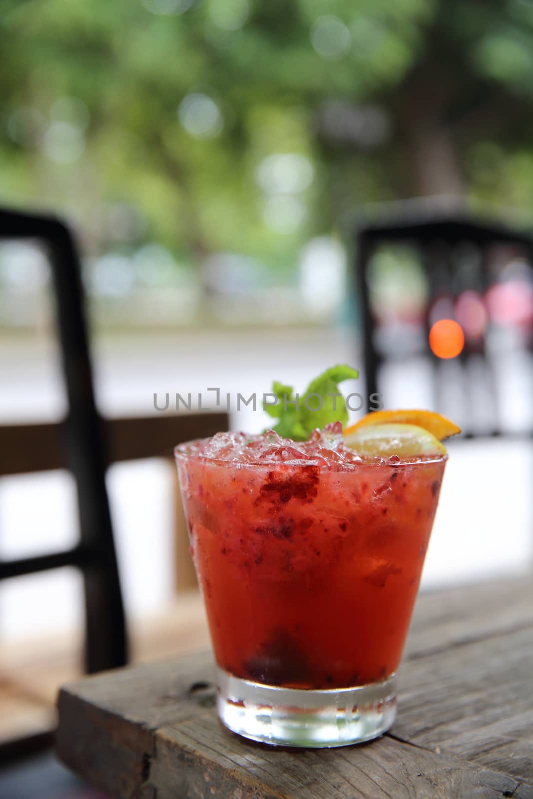 mai tai cocktail with orange cherry fruits on wood background