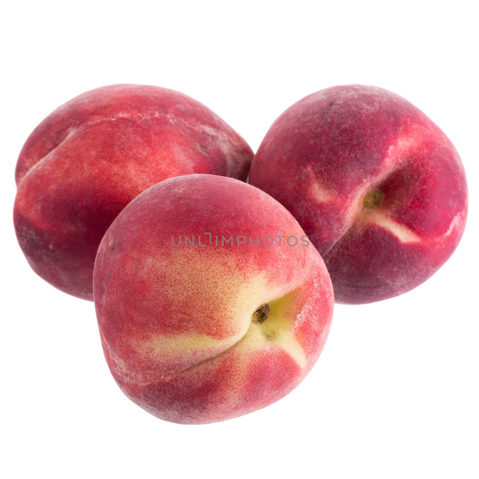 Ripe fresh peaches isolated on white background.