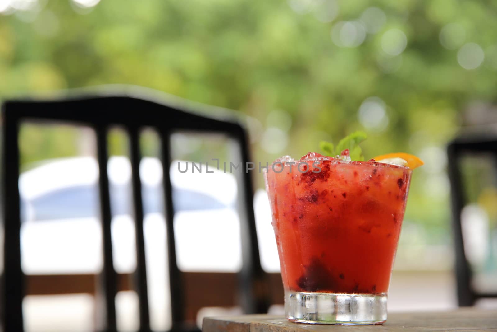 mai tai cocktail with orange cherry fruits on wood background