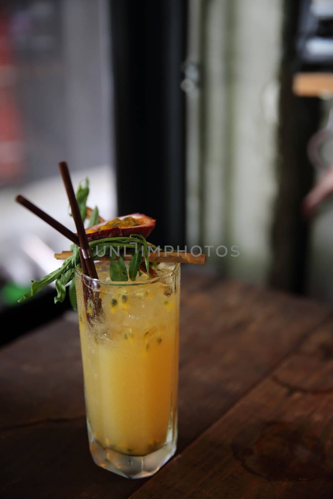 mai tai cocktail with orange cherry fruits on wood background