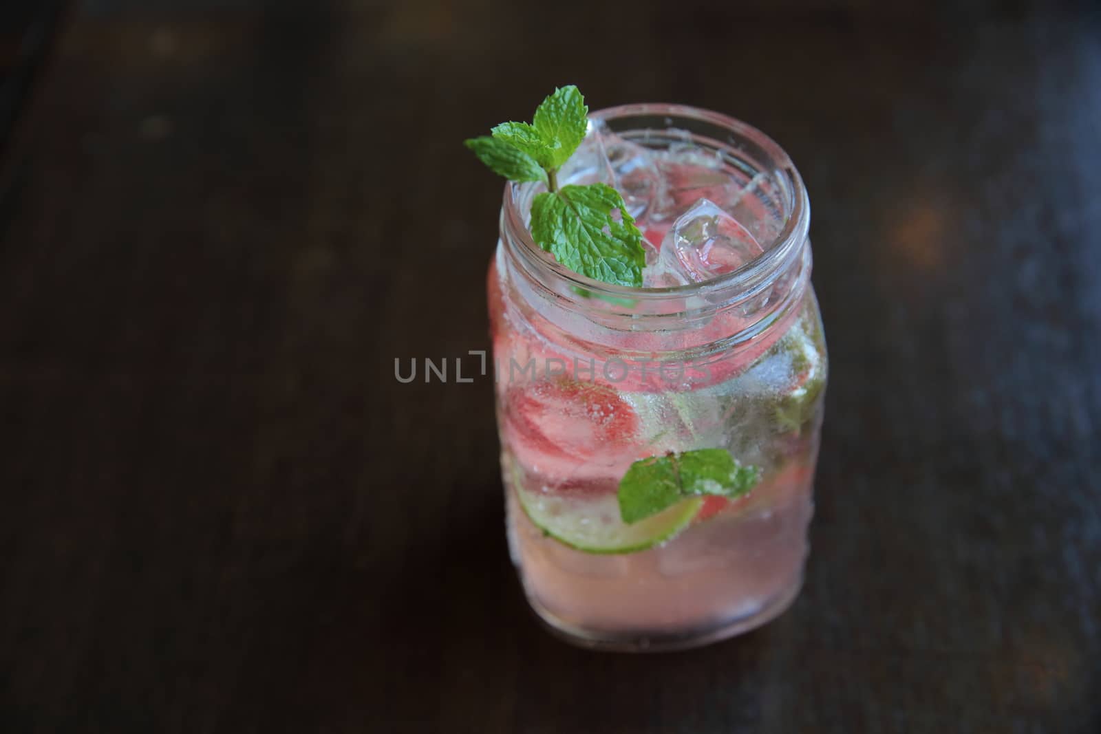 strawberry cocktail on wood background