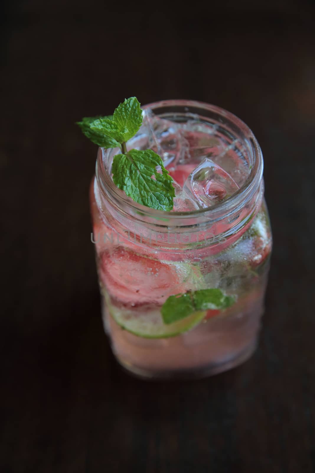 strawberry cocktail on wood background