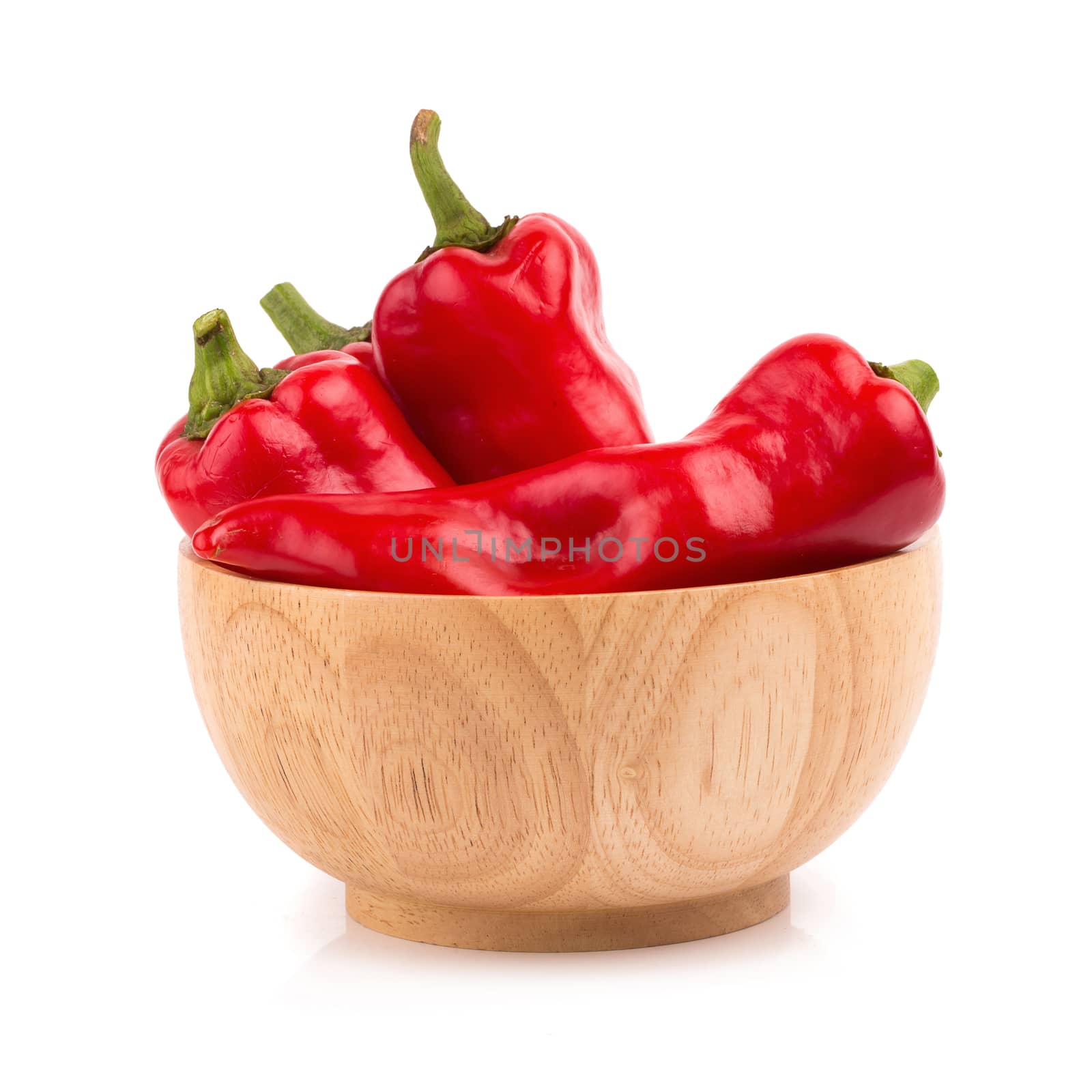 red chilli vegetable in Wooden bowl Isolated on white background by kaiskynet