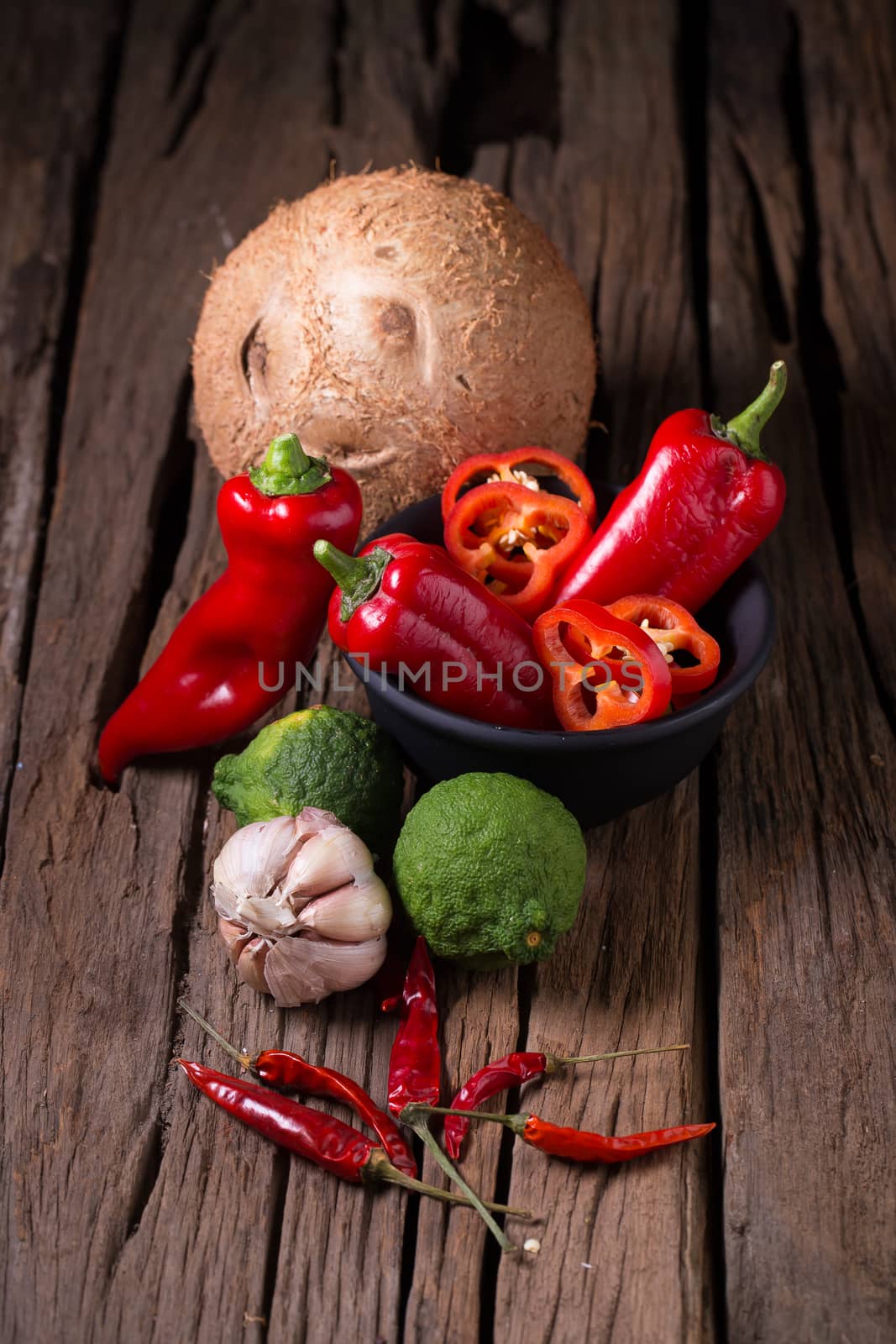 Spices and herbs on wooden background by kaiskynet