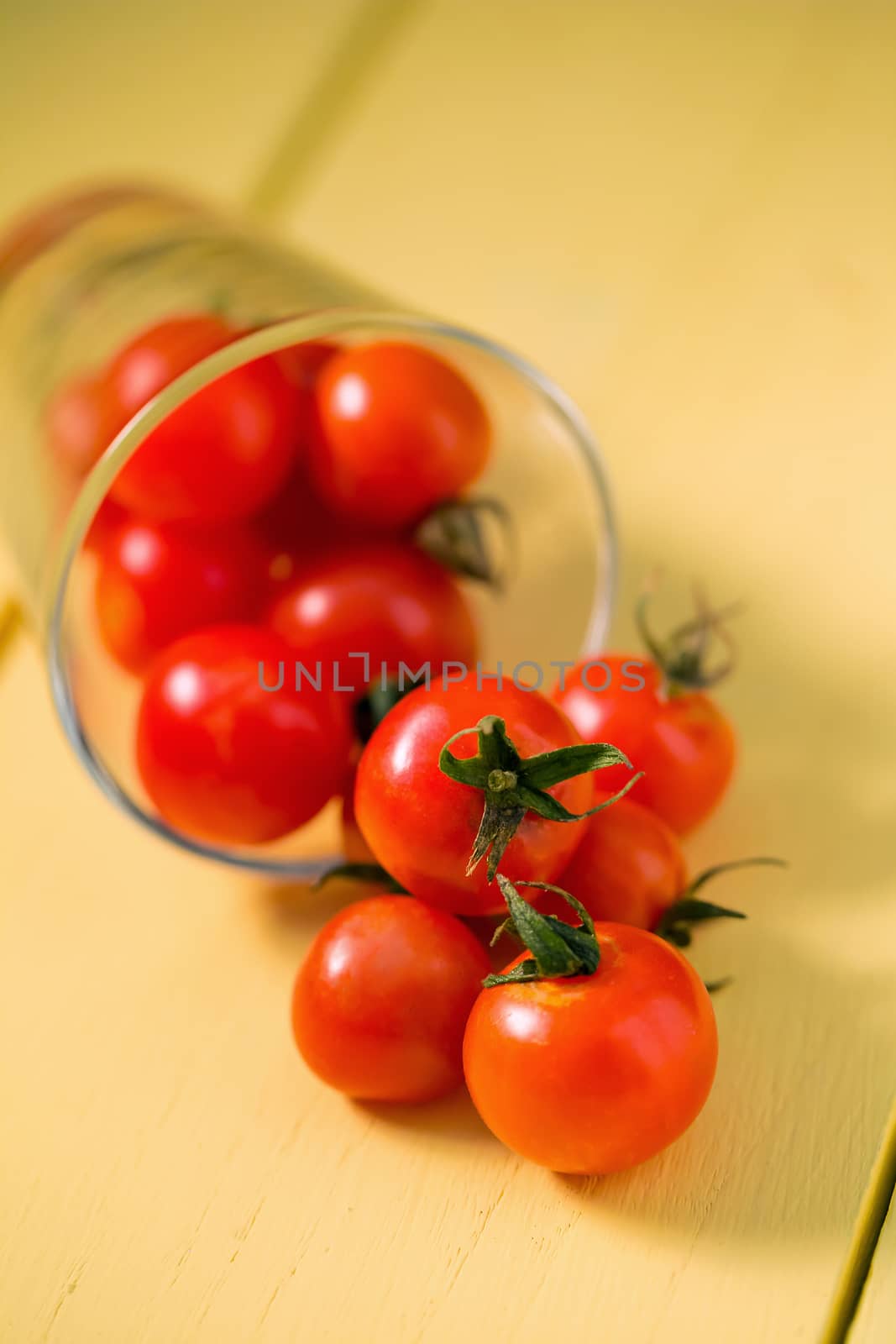Fresh tomatoes Healthy food concept. on yellow table background by kaiskynet