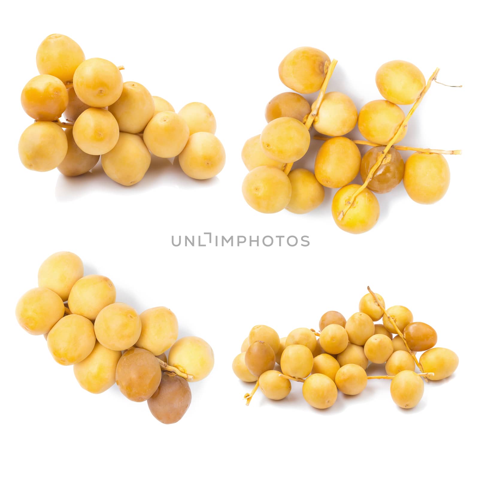 yellow raw dates isolated on white background by kaiskynet