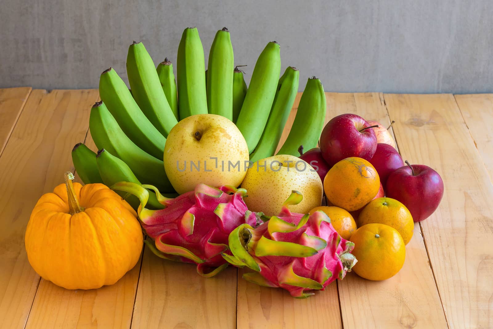 Fruits diet concept. different fruits on wooden table by kaiskynet