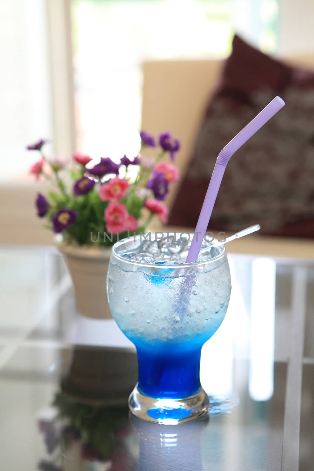 blue cocktail martini with flower by piyato