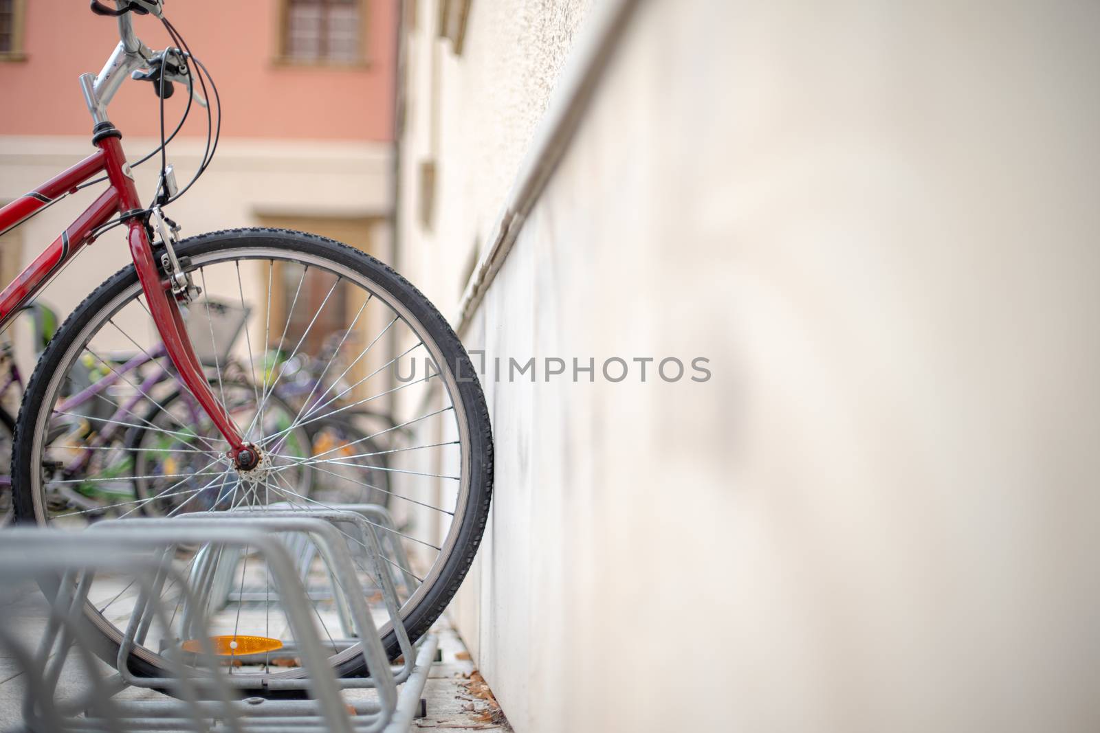 bicycle parked in a rack in the big city center