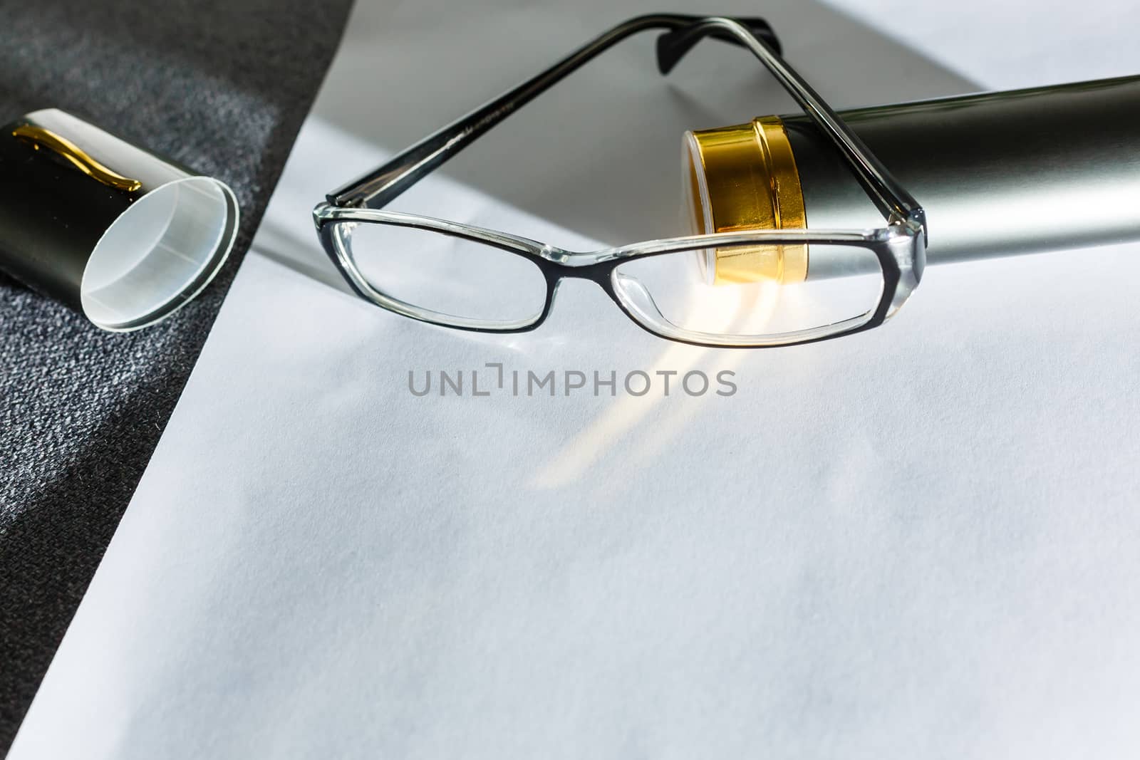 Glasses on paper with the engineer's office. by Andelov13