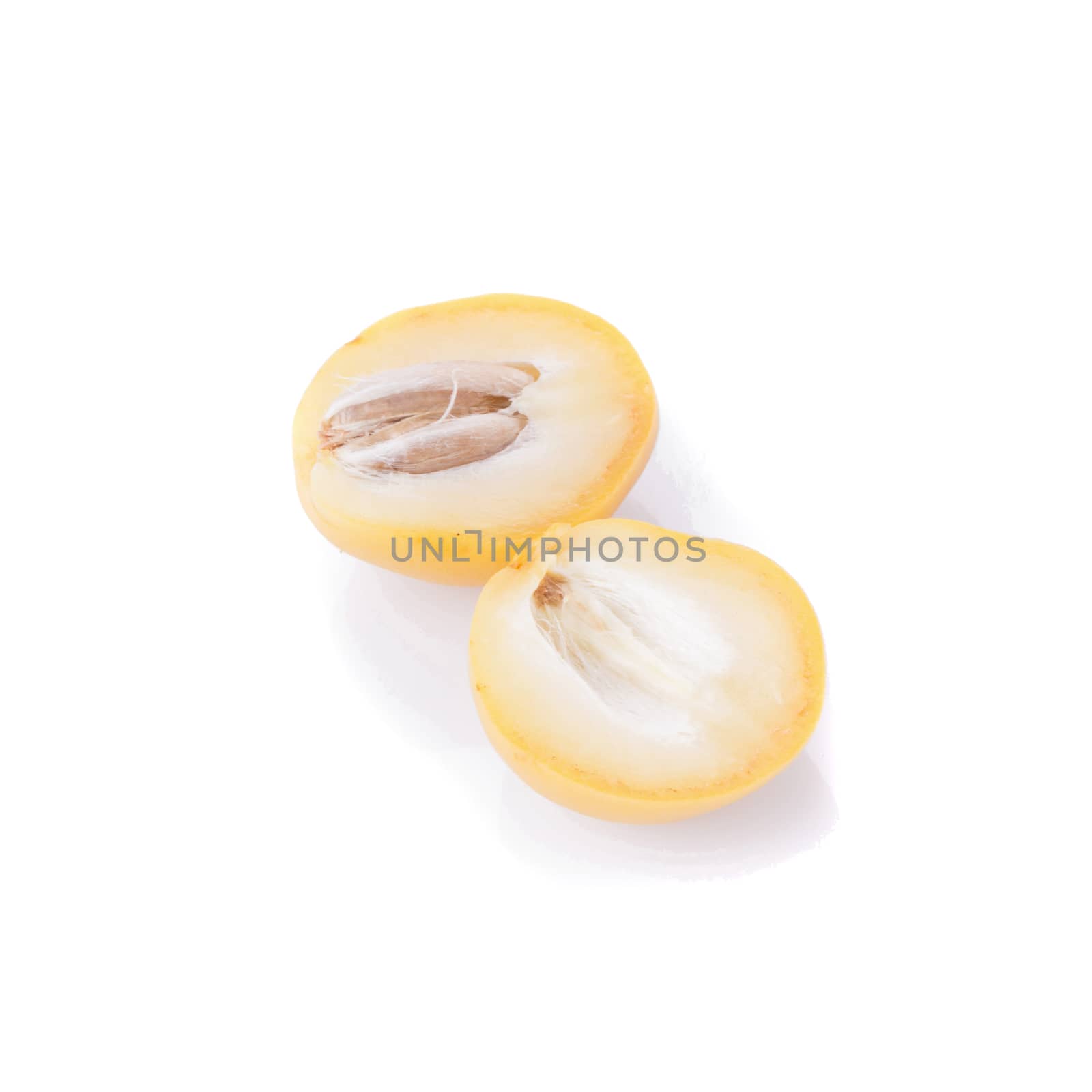 yellow raw dates isolated on white background by kaiskynet