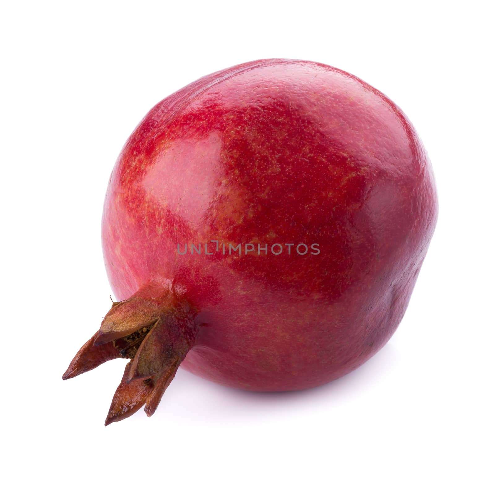 Ripe pomegranate fruit isolated on white background.