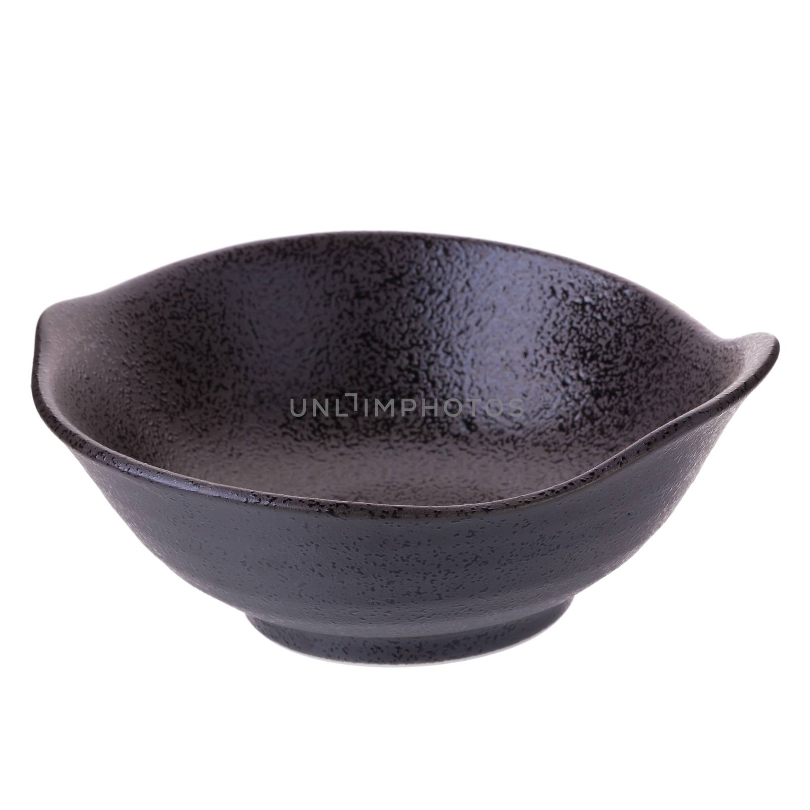 black ceramic bowl on a white background. by kaiskynet
