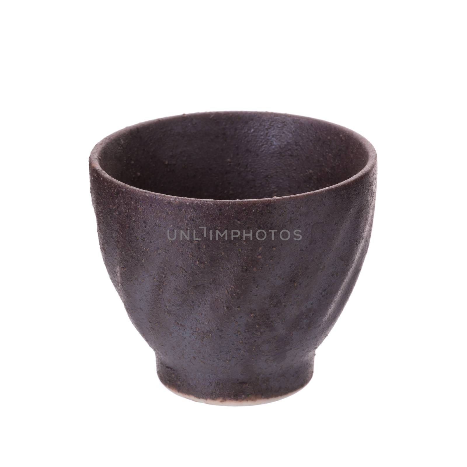 Black traditional tea cup of cast iron isolated on white background.
