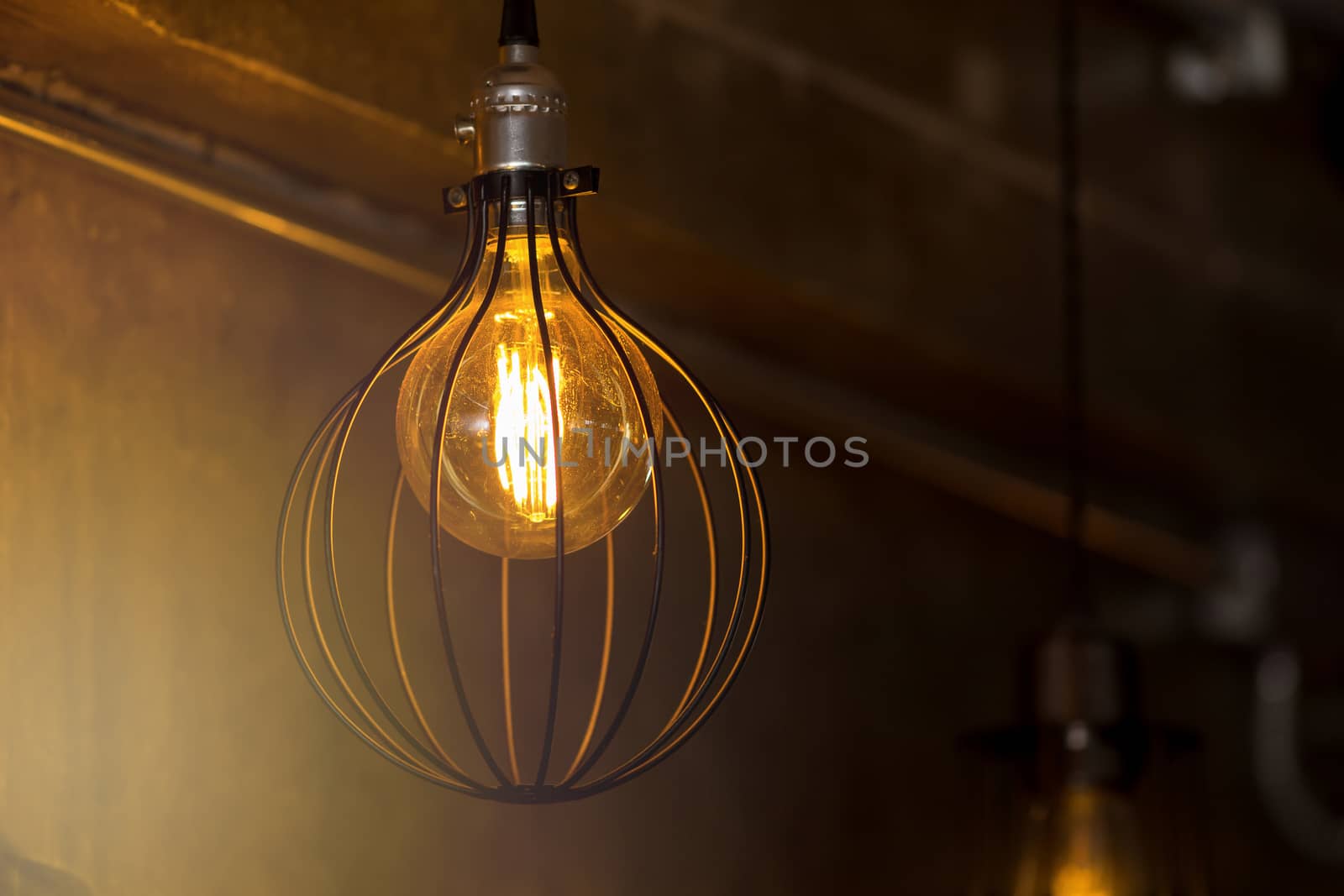 Decorative antique edison style light bulbs against brick wall background.