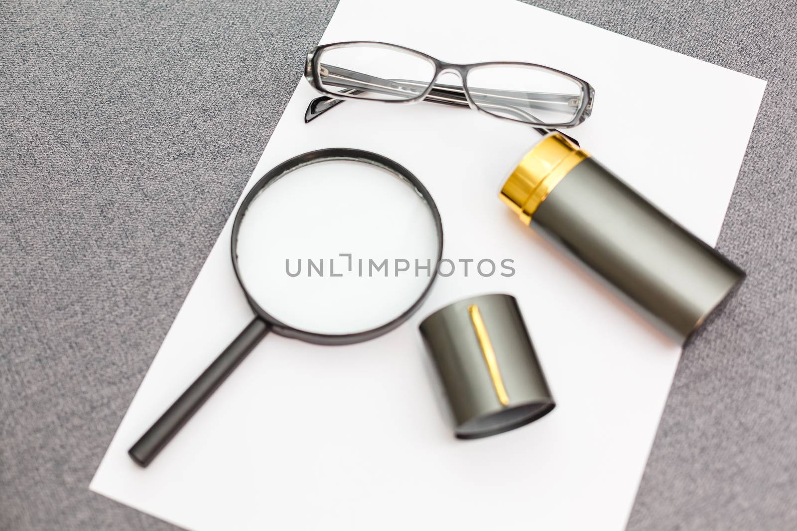 Magnifier,glasses and notebook