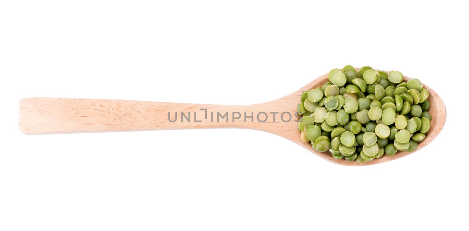 Split Green Peas on wooden spoon isolated on white background.