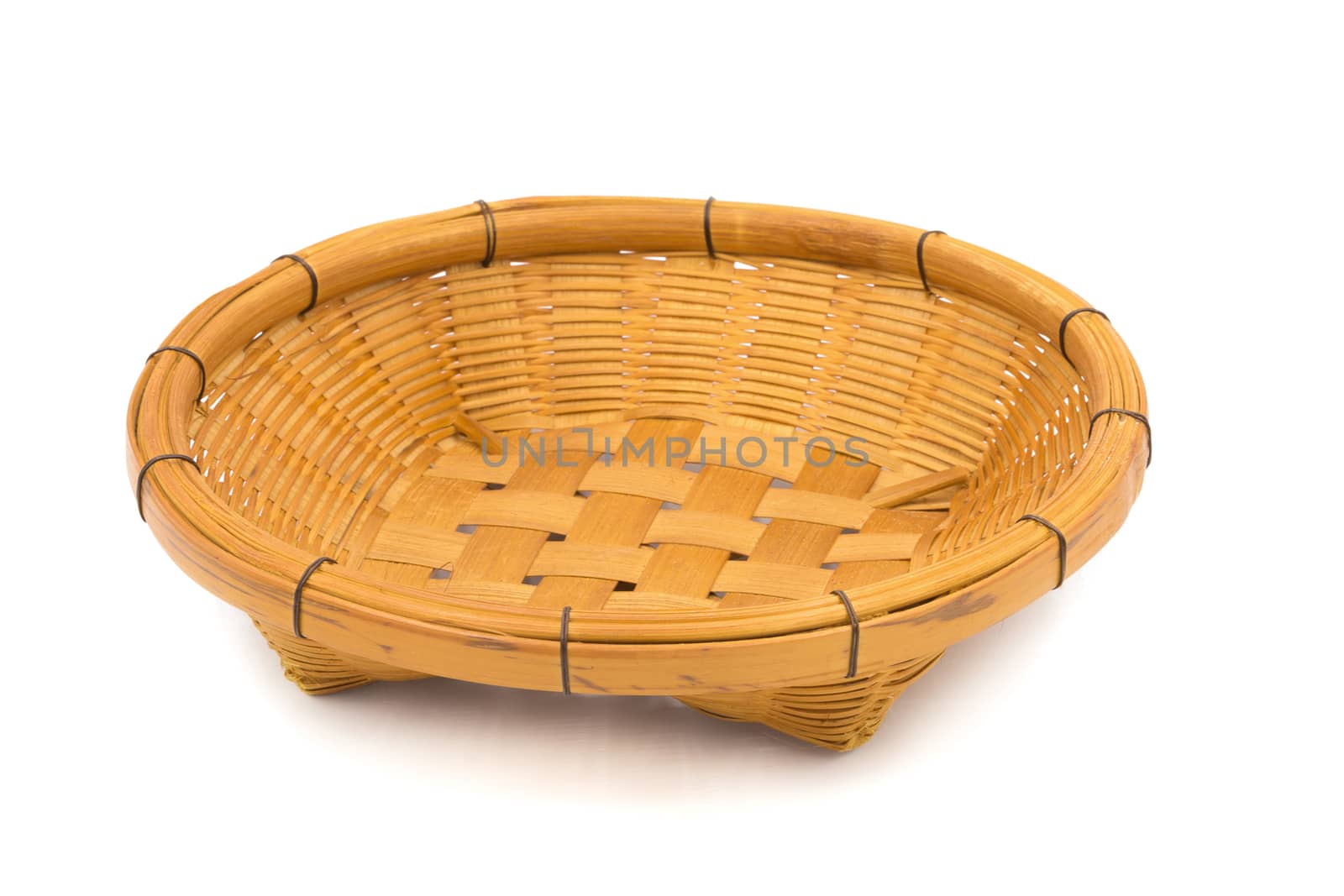 Wicker dish isolated on a white background by kaiskynet