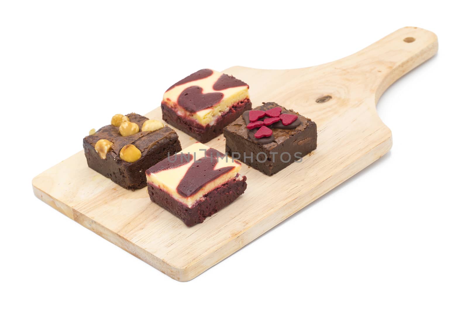 mini brownie on wooden board isolated on white background by kaiskynet