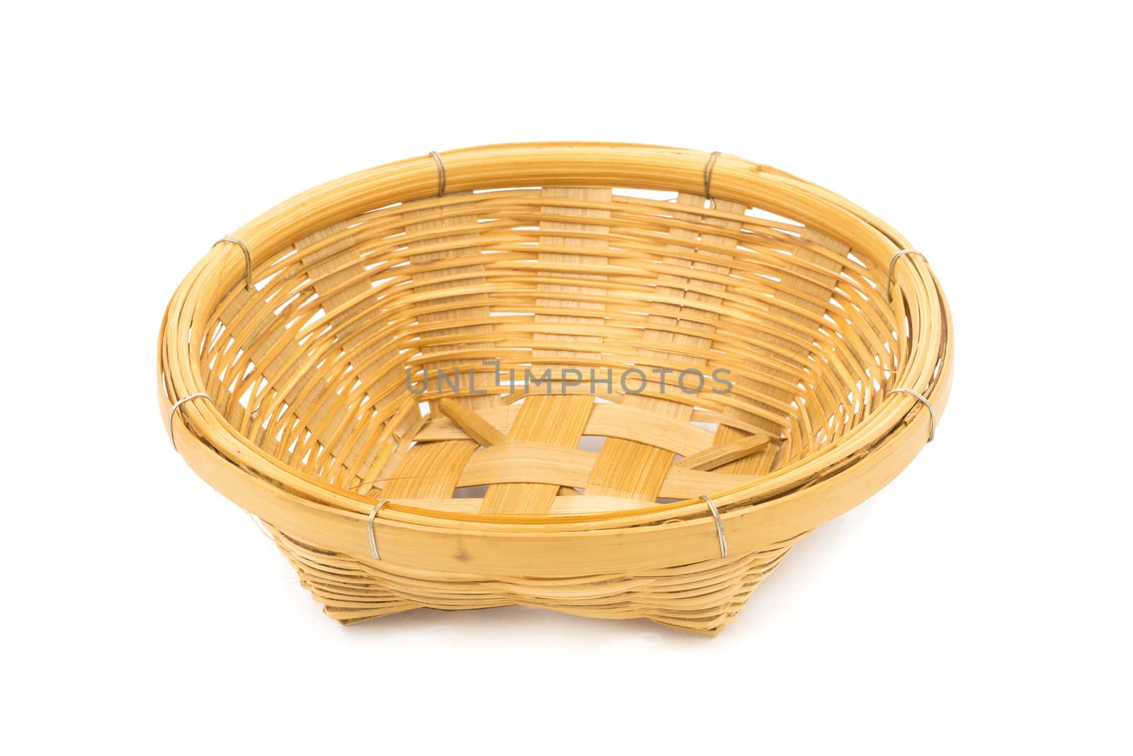 Wicker dish isolated on a white background by kaiskynet