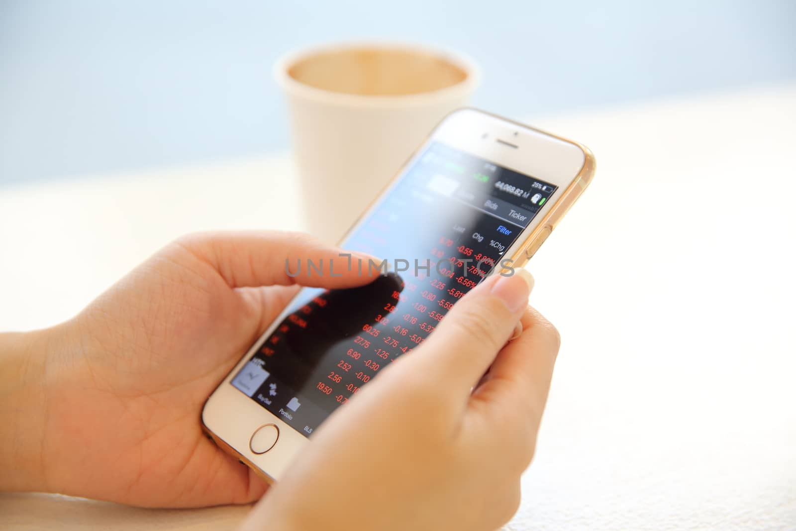 business trading online on smartphone with woman hand