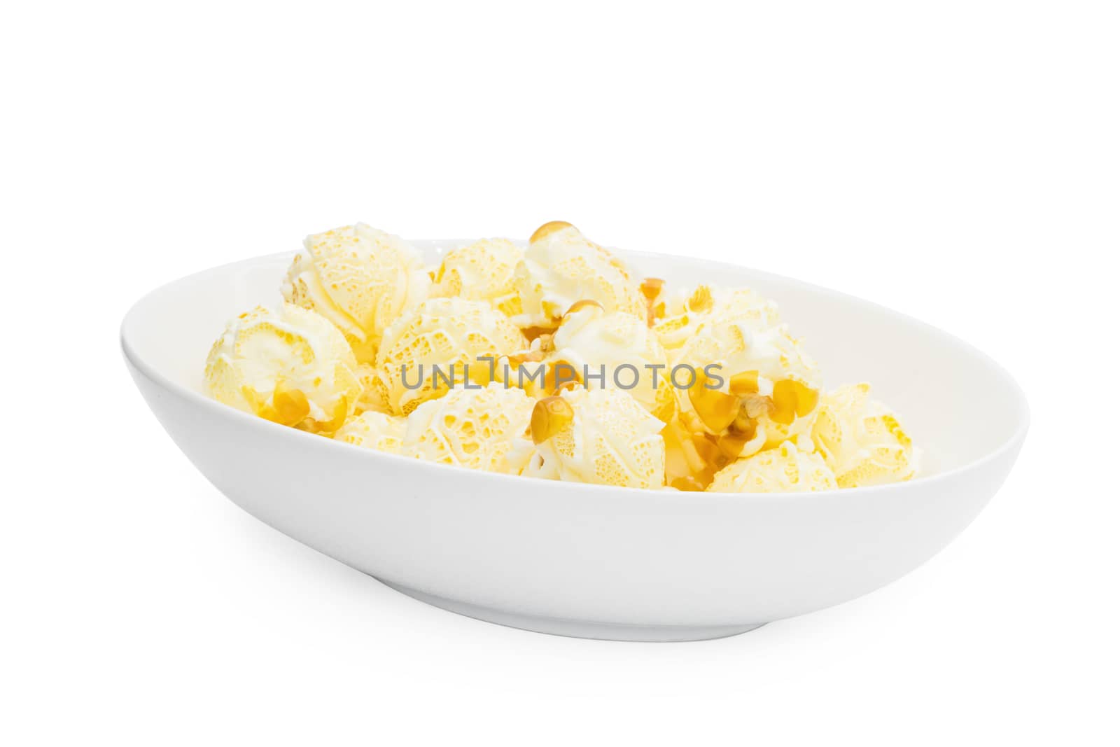 Popcorn in a plate isolated on white background by kaiskynet