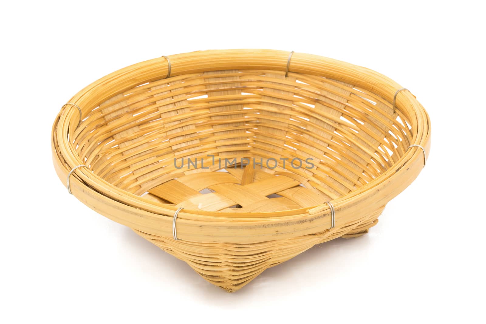 Wicker dish isolated on a white background by kaiskynet