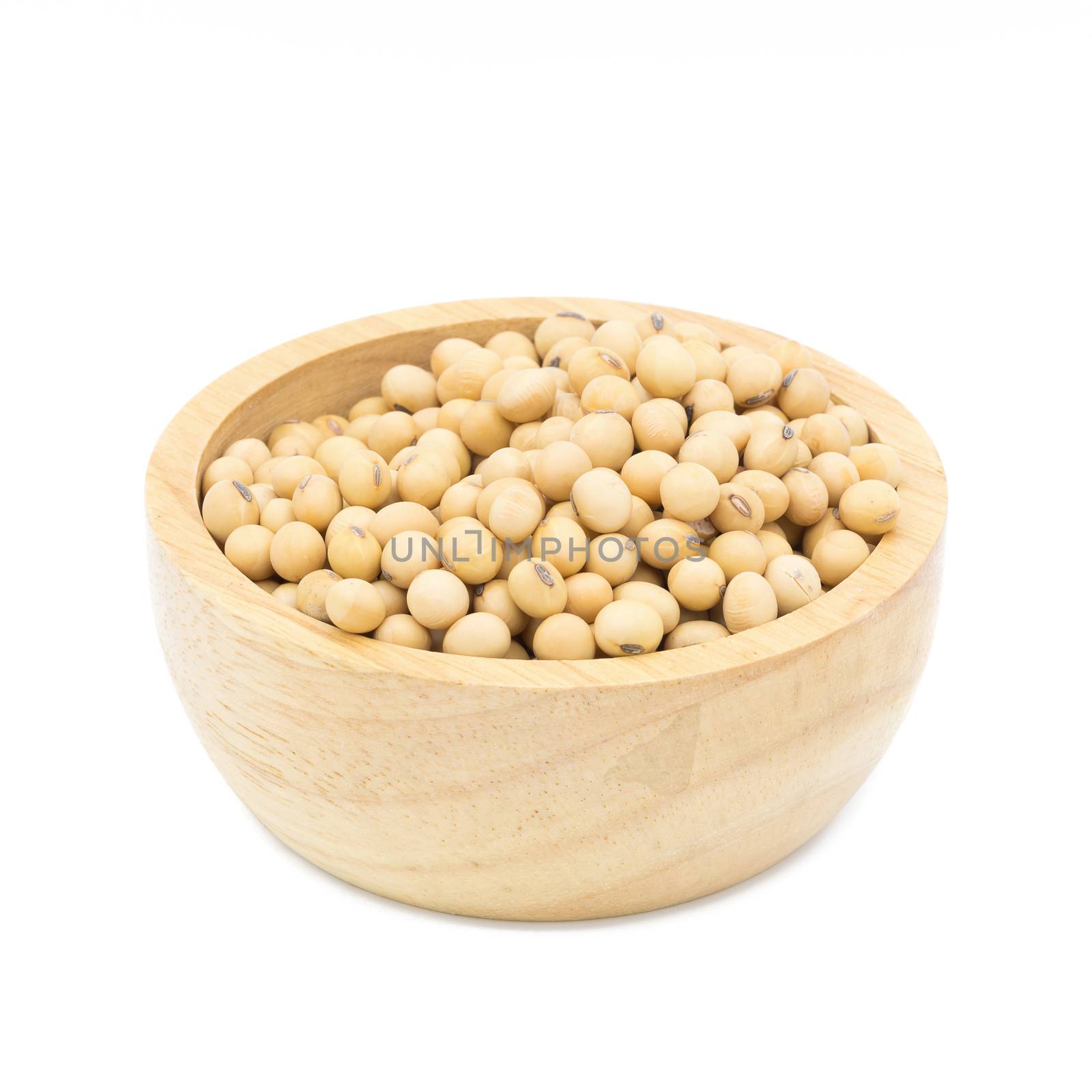 Soybeans in a wooden bowl on a white background by kaiskynet