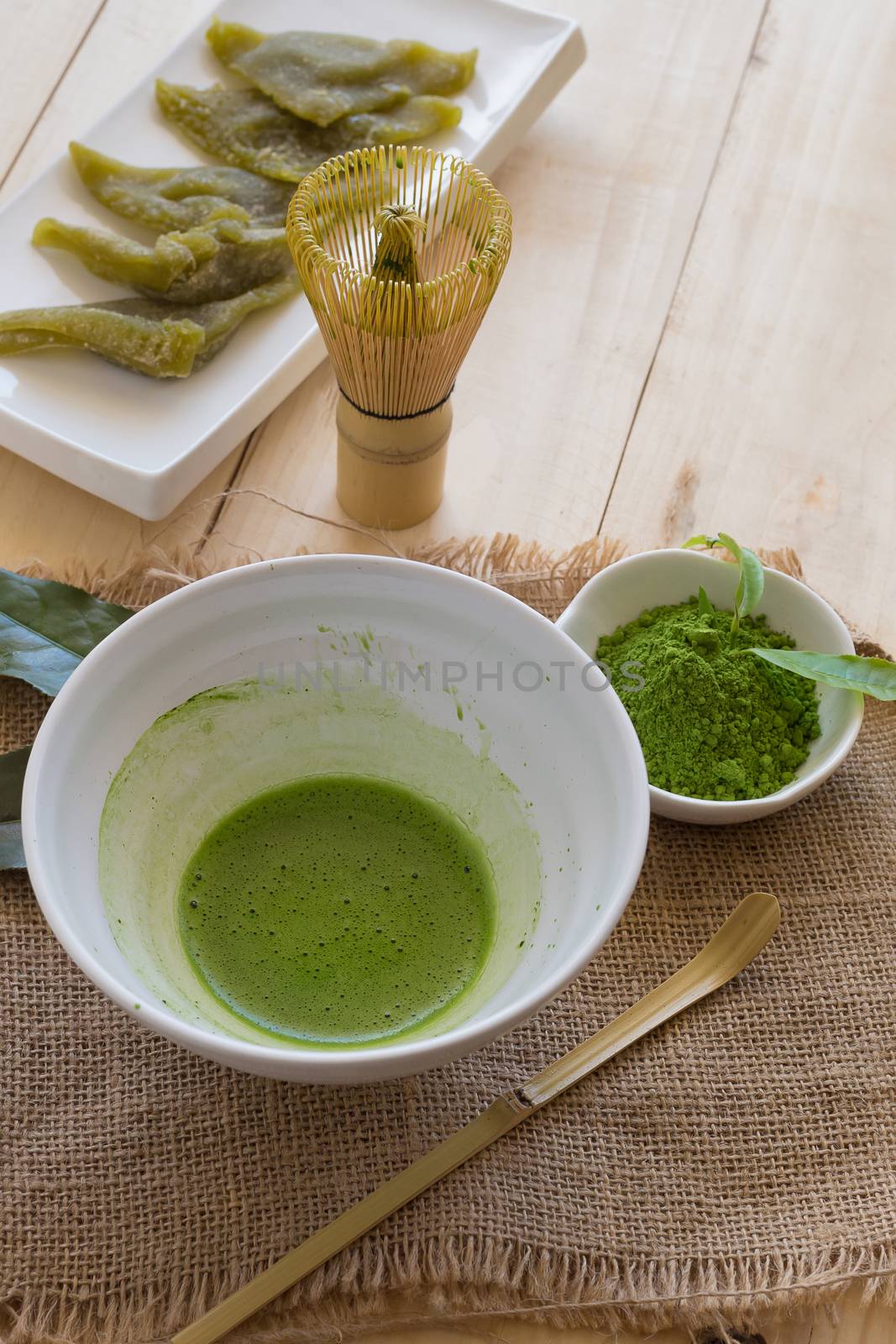 Set of matcha powder bowl, wooden spoon and whisk, green tea leaf, Organic Green Matcha Tea ceremony.