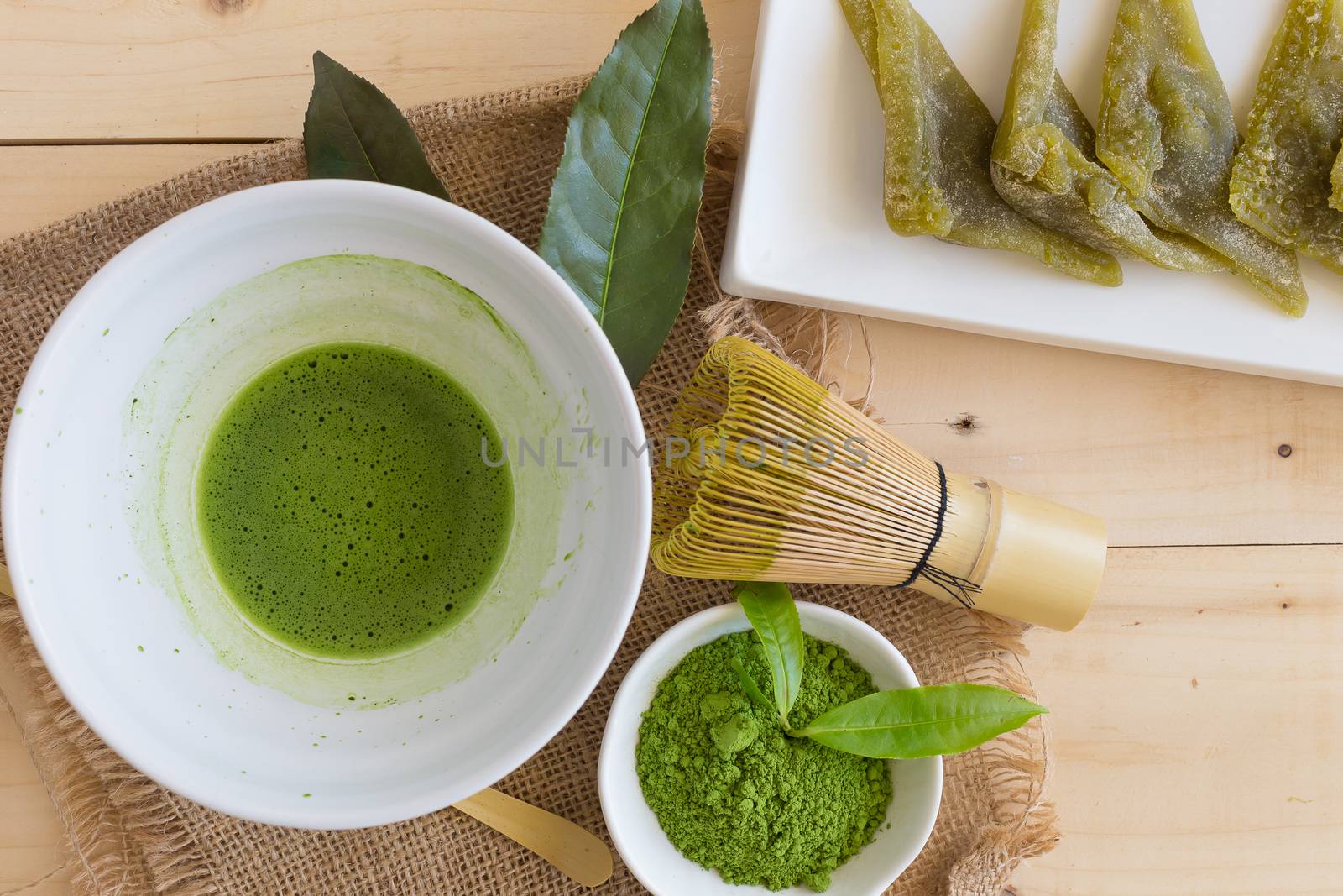 Set of matcha powder bowl, wooden spoon and whisk, green tea leaf, Organic Green Matcha Tea ceremony.