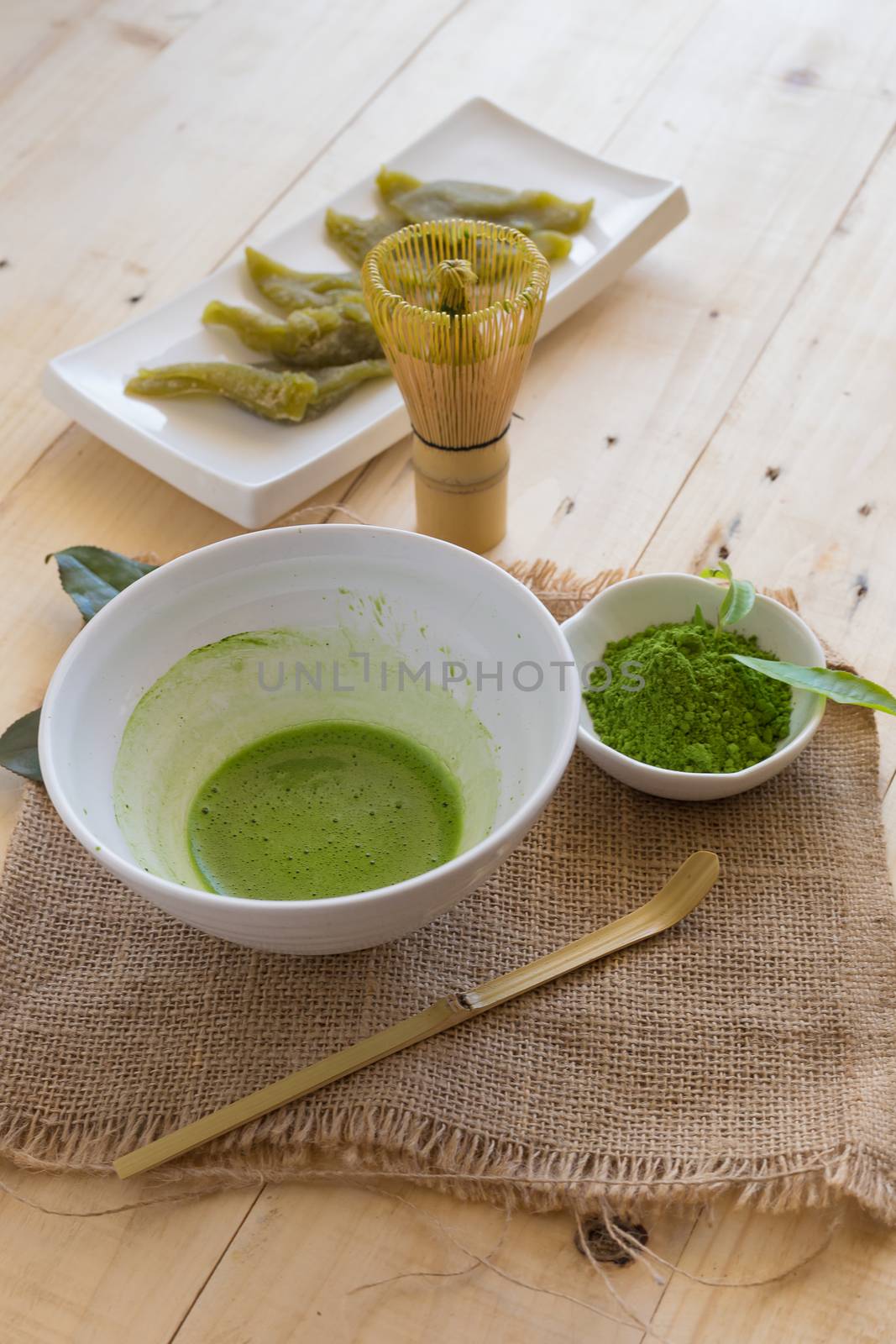Set of matcha powder bowl, wooden spoon and whisk, green tea lea by kaiskynet