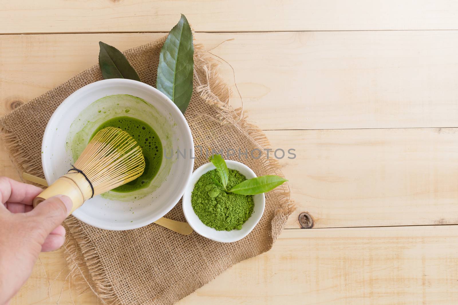 Set of matcha powder bowl, wooden spoon and whisk, green tea leaf, Organic Green Matcha Tea ceremony.