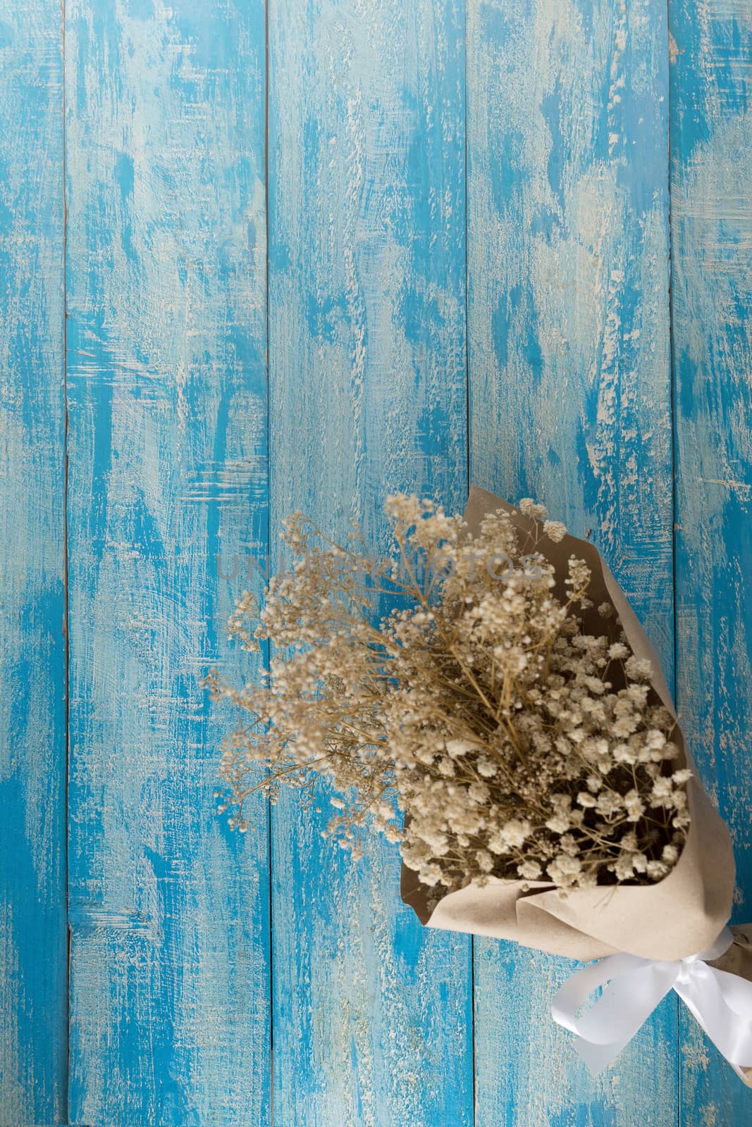 Dry bouquet on a blue Rustic Background.