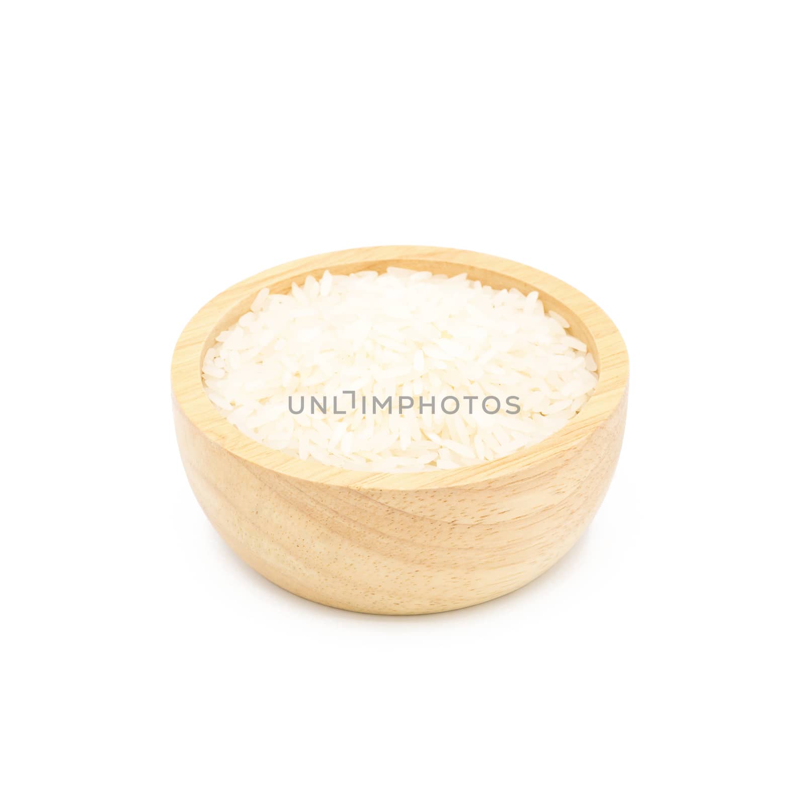Rice in a wooden cup isolated on white background.